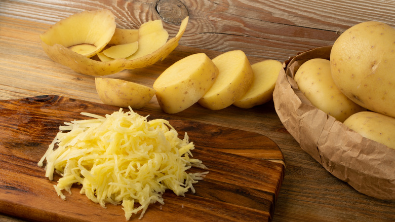 Grated potatoes on a cutting board