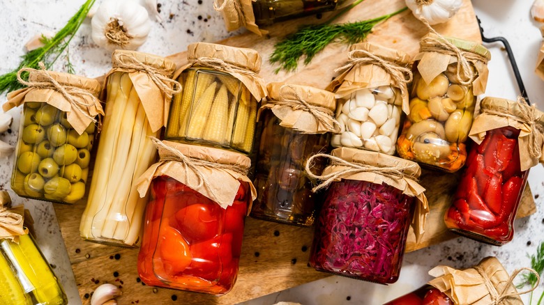 Jars of various pickled fruits and vegetables