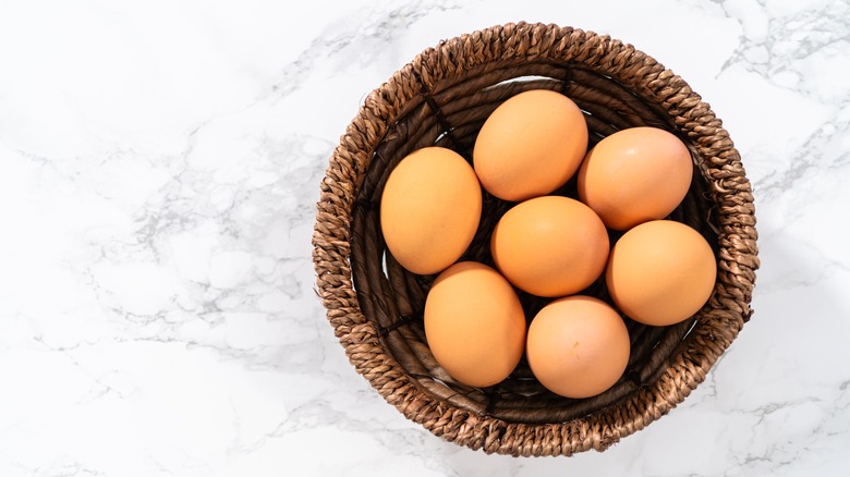 Brown eggs in a woven basket