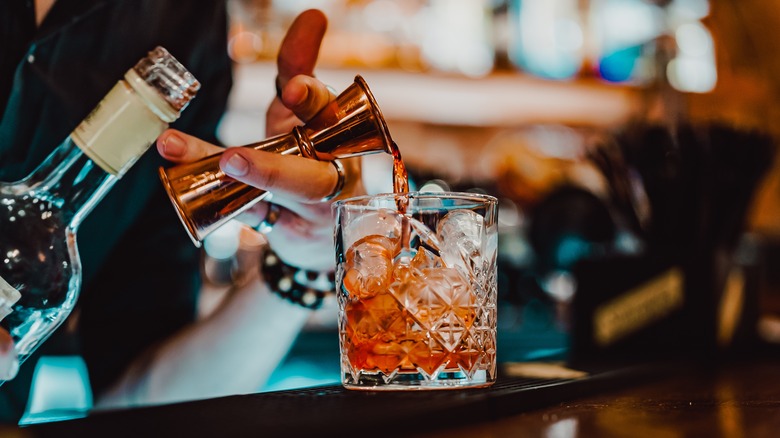 bartender making a negroni