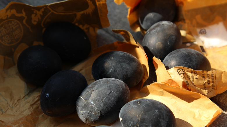 Owakudani black eggs in ripped-open yellow packages