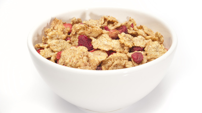 Dried strawberries with cereal in bowl