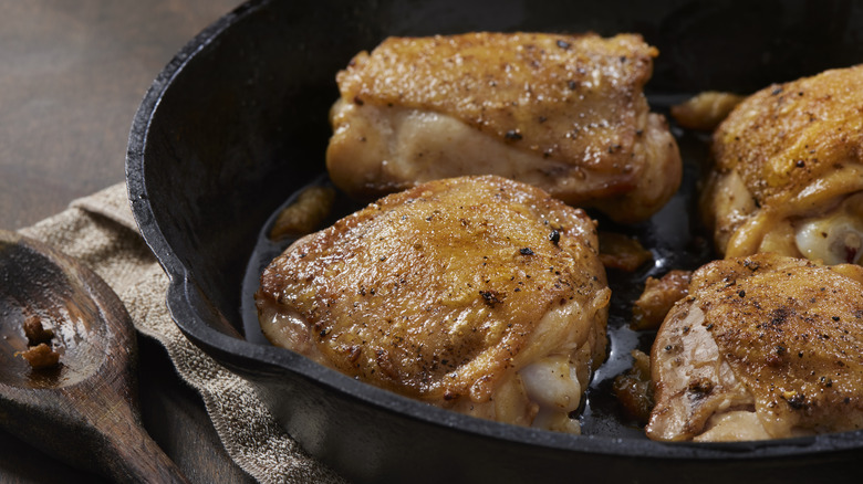 Crispy chicken thighs in cast iron pan