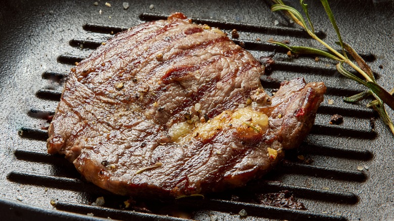 Steak in a pan with rosemary