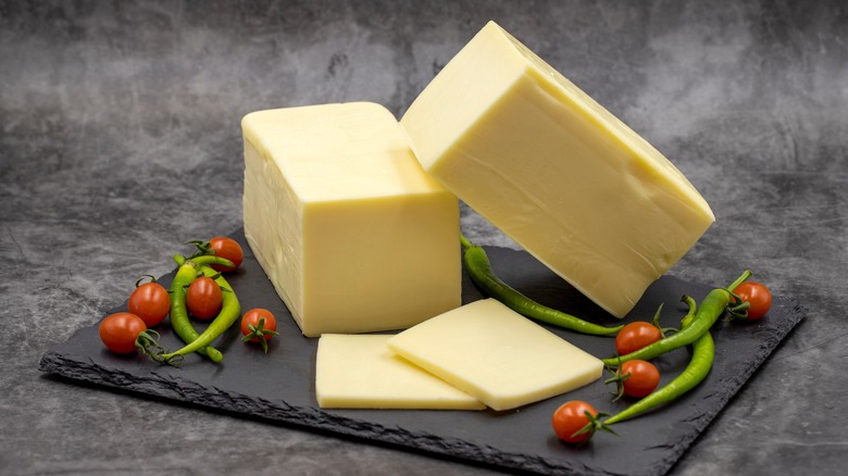 Blocks of cheddar on a slate