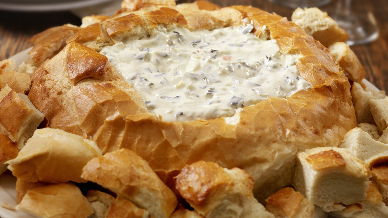 Spinach artichoke dip filled bread bowl