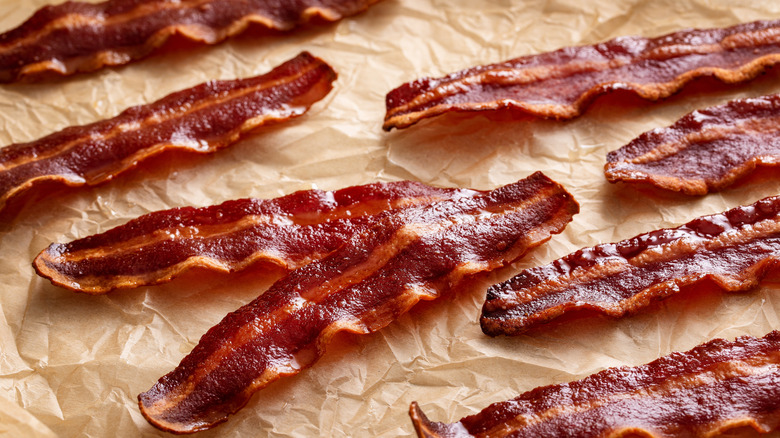 crispy turkey bacon laid out on parchment paper