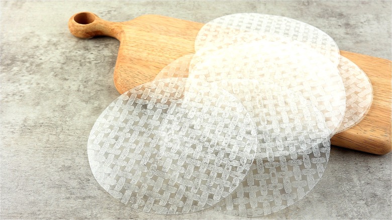 Rice paper sheets on cutting board