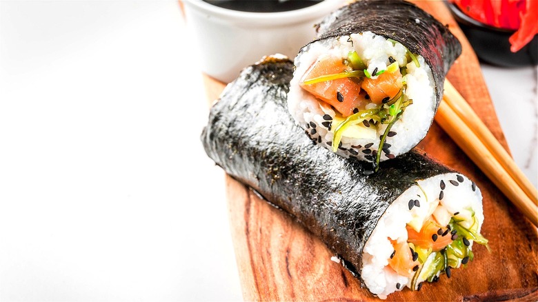 Sushi burritos on wooden board