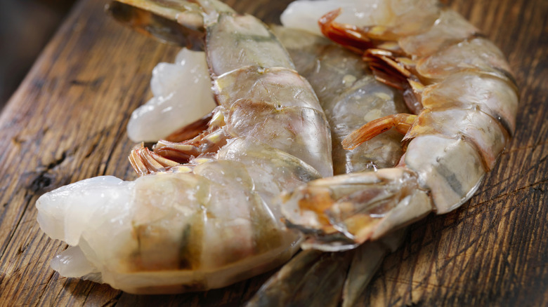 Large raw shrimp on a cutting board