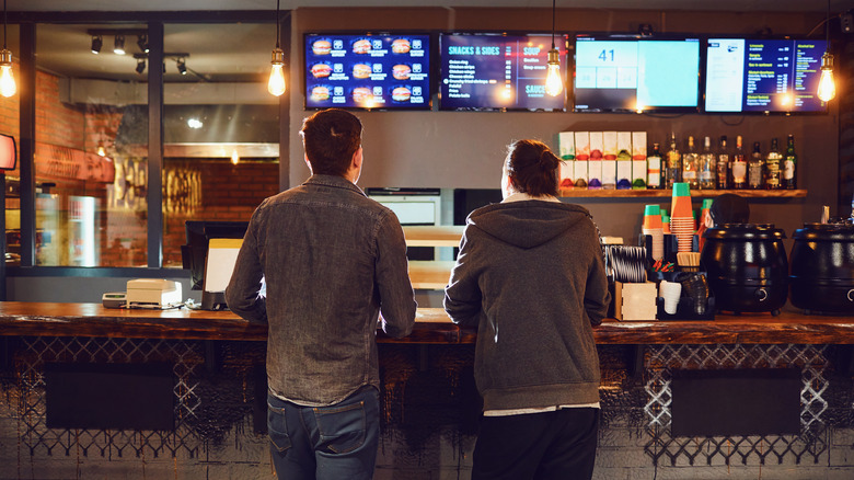 Couple ordering fast food