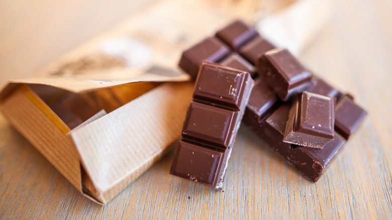 broken chocolate bar arranged on wrapper