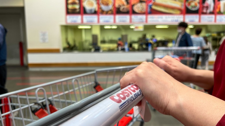 pushing costco shopping cart