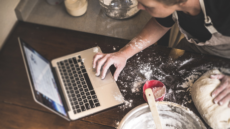 A person baking on their laptop