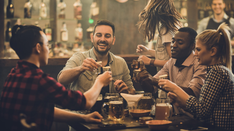 friends taking liquor shots