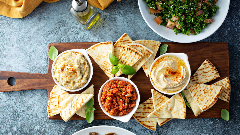 baba ganoush on platter with pita bread