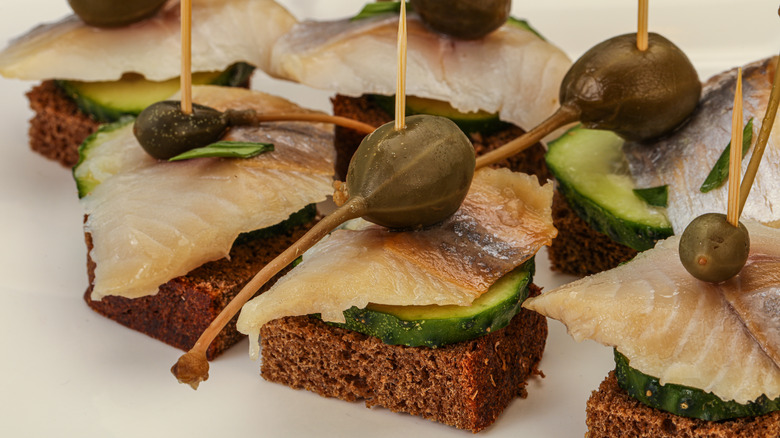 Fish canape with caperberry