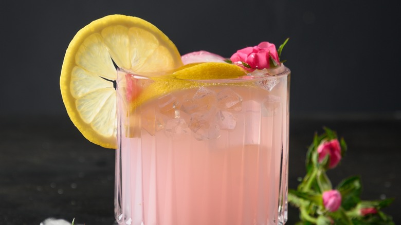 pink cocktail with lemon and roses