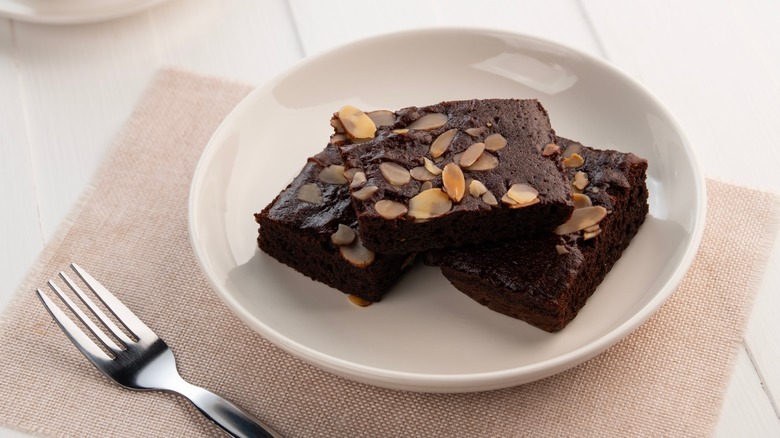 Plate of brownies with toasted almonds