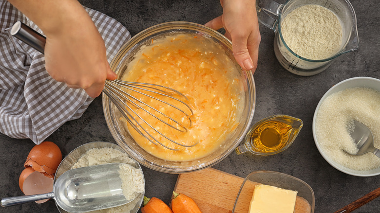 mixing together carrot cake batter