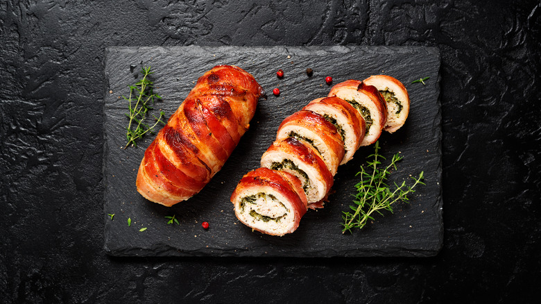 Chicken wrapped in bacon black slate