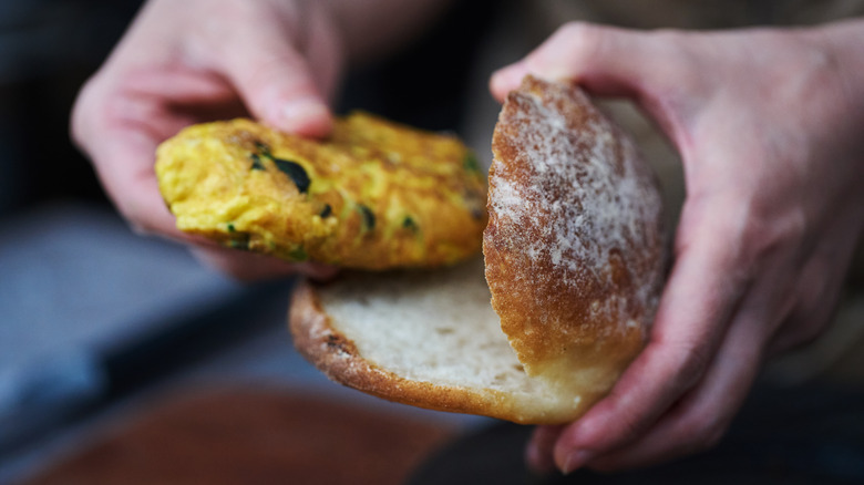 Omelet-wrapped patty with bun