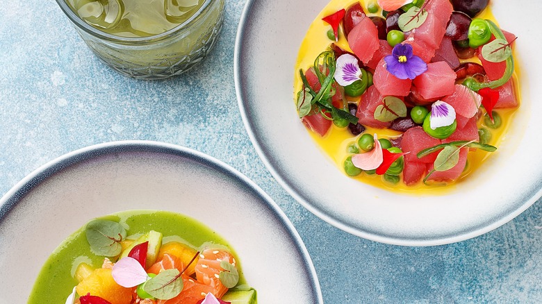 tuna and salmon ceviche with floral garnish