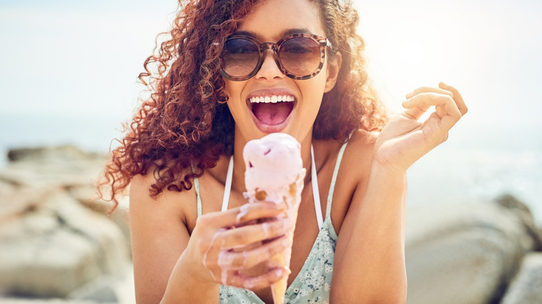 woman smiling with ice cream cone