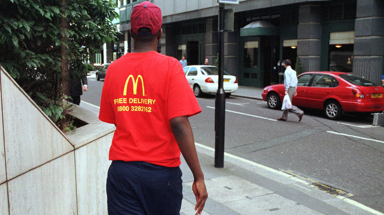 McDonald's employee walking down street