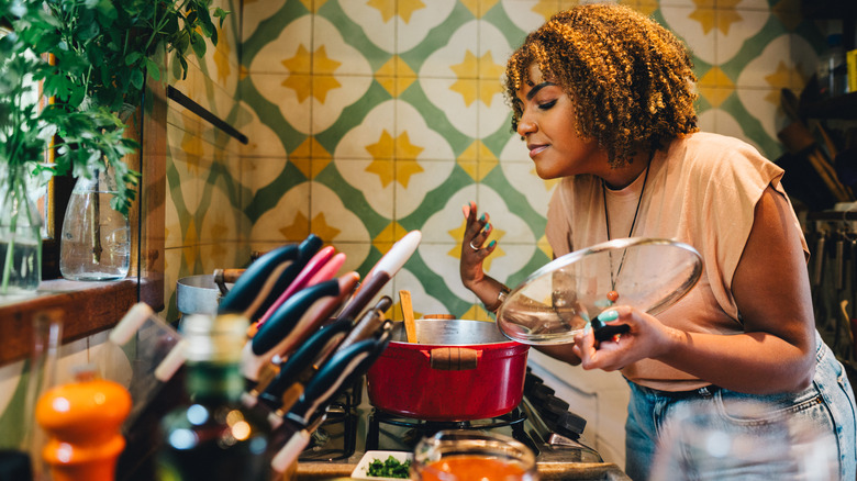 woman cooking on stovetop