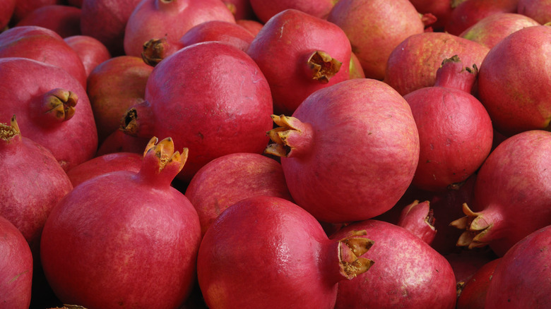 Several whole pomegranates