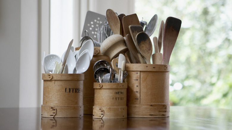 Jars of utensils on countertop