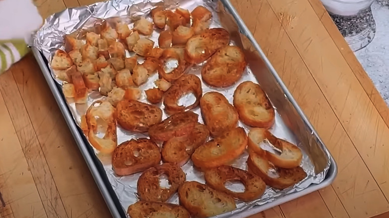 baked croutons on cookie sheet