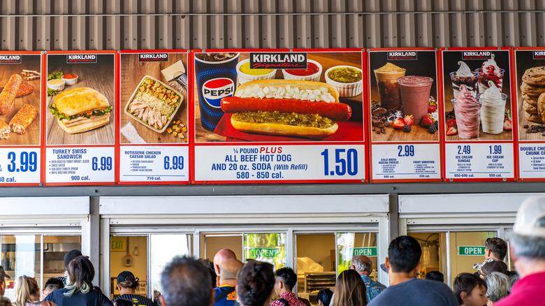 Costco food court overhead menu with large images of the foods on sale