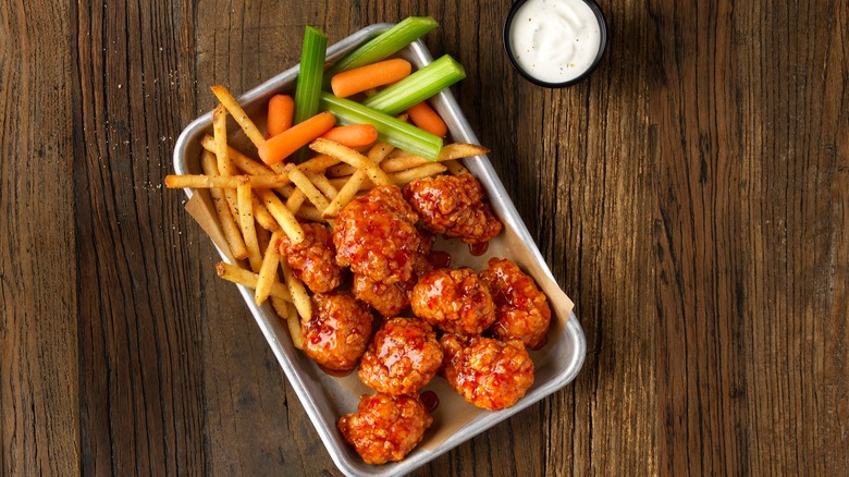 boneless buffalo wings, fries, sauce, veggies