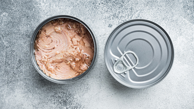 Open and closed cans of tuna