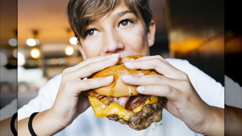 boy eating burger