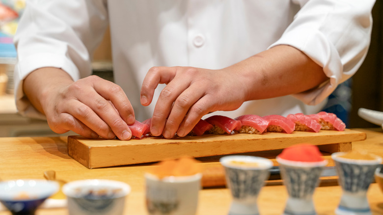 chef preparing a sushi omakase course