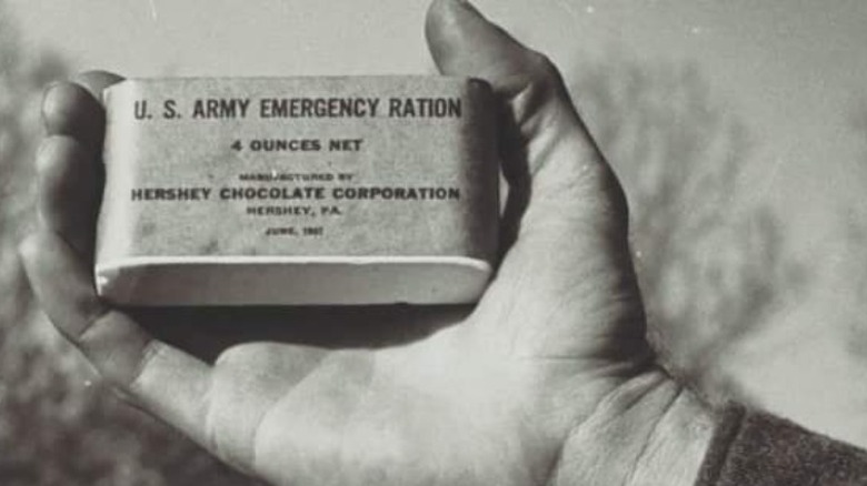 A hand holding an emergency ration