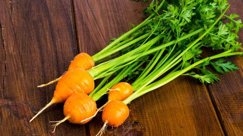 Parisian market carrots on wooden tabletop