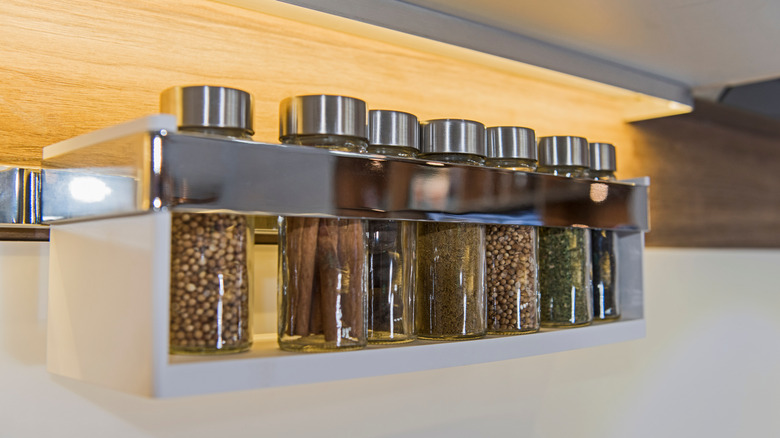 modern spice rack with peppercorns