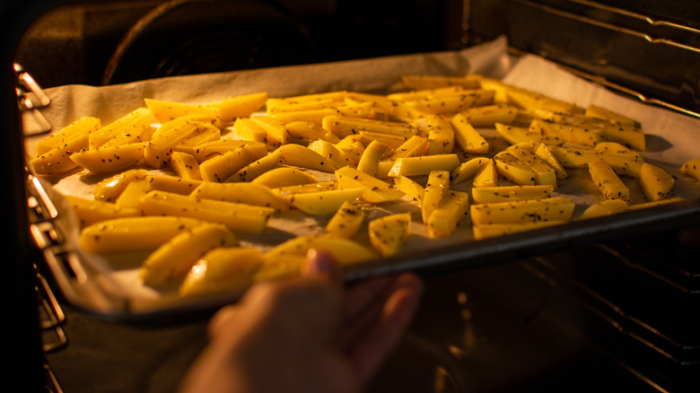 French fries baking in an oven