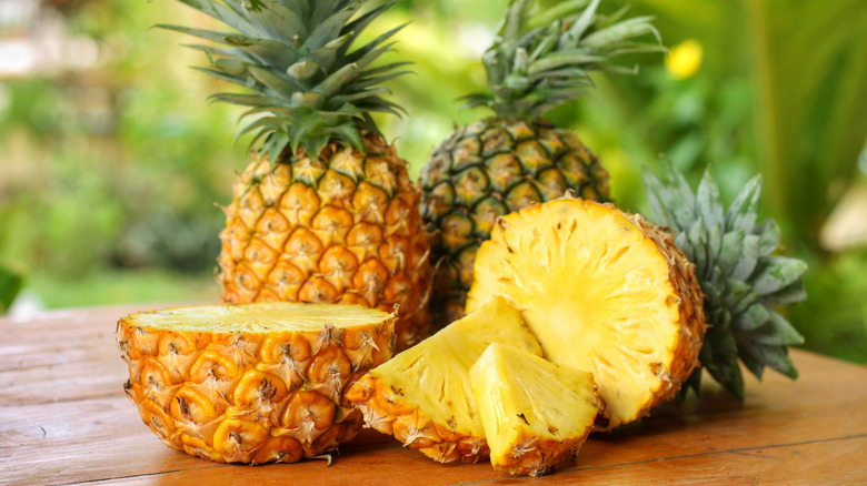 Sliced pineapple on wooden table