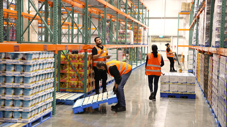 Employees restocking Costco shelves