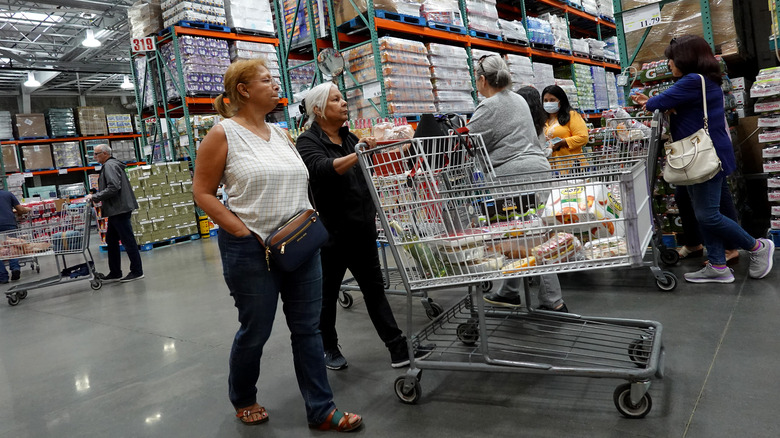 People pushing large Costco cart