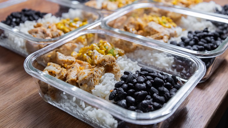 Meal prepped chicken, bean, and rice bowls