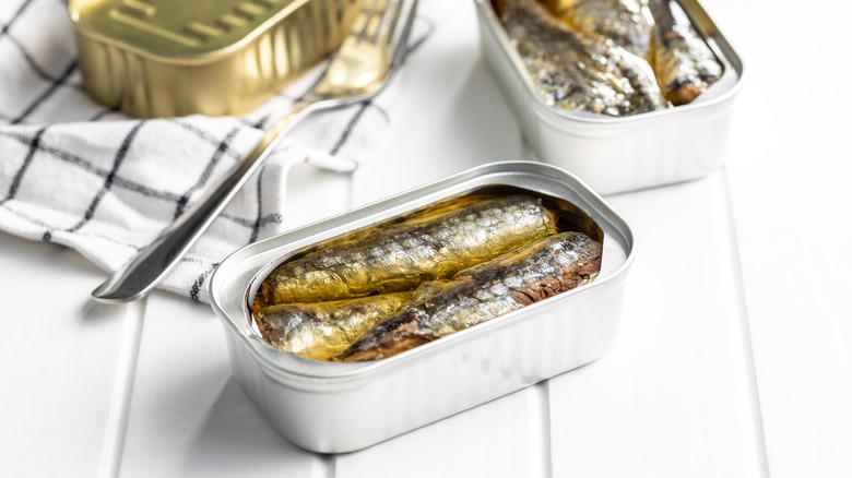 canned sardines and fork