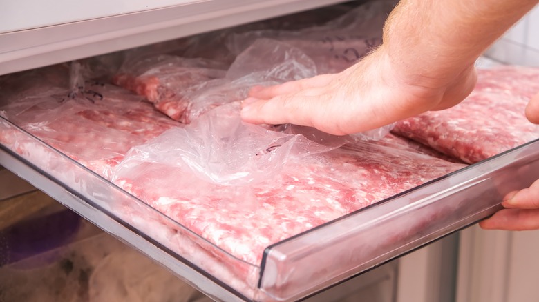 Man refreezing ground beef