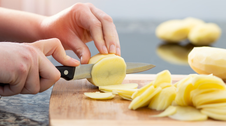 cutting potatoes