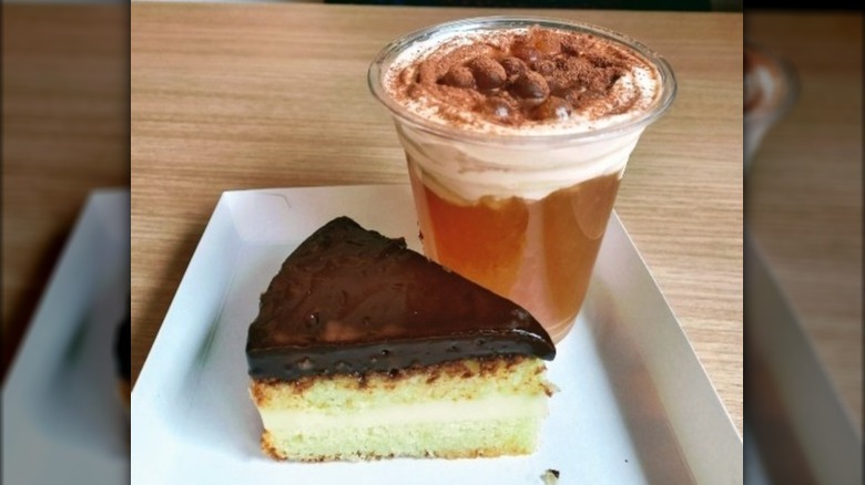 Cup of cheese tea with cake